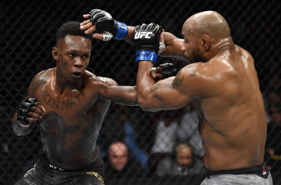 Israel Adesanya of Nigeria punches Yoel Romero of Cuba in their UFC middleweight championship fight during the UFC 248 event at T-Mobile Arena on Saturday in Las Vegas, Nevada.