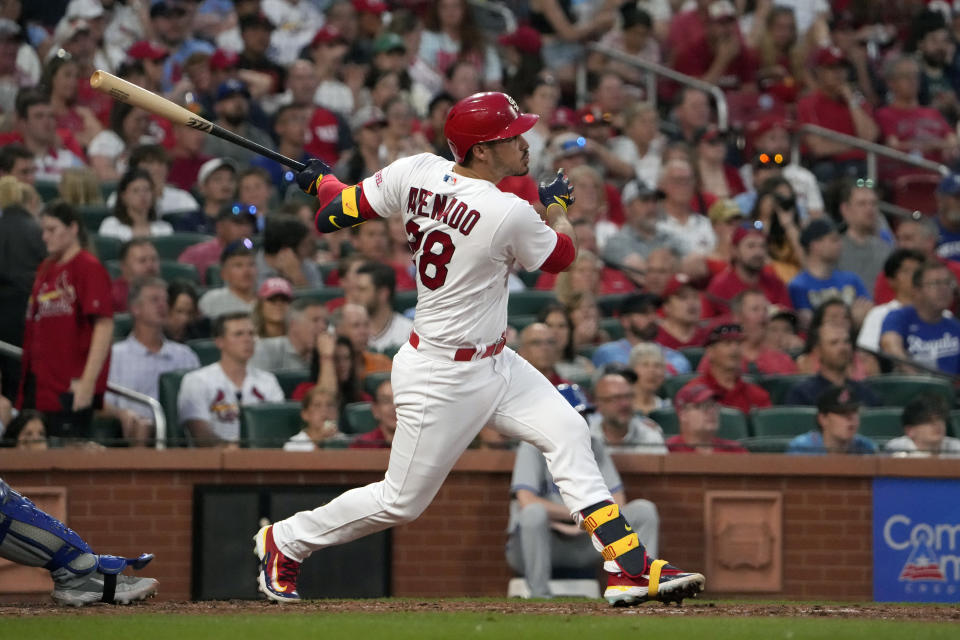 St. Louis Cardinals' Nolan Arenado follows through on an RBI double during the sixth inning of a baseball game against the Kansas City Royals Tuesday, May 30, 2023, in St. Louis. (AP Photo/Jeff Roberson)