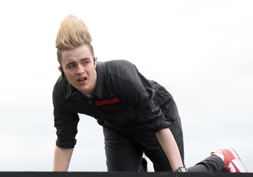 WESTON-SUPER-MARE, ENGLAND - JULY 4:  Edward Grimes of Jedward is injured while performing on the main stage at T4 On The Beach on July 4, 2010 in Weston-super-Mare, England. (Photo by Samir Hussein/Getty Images)