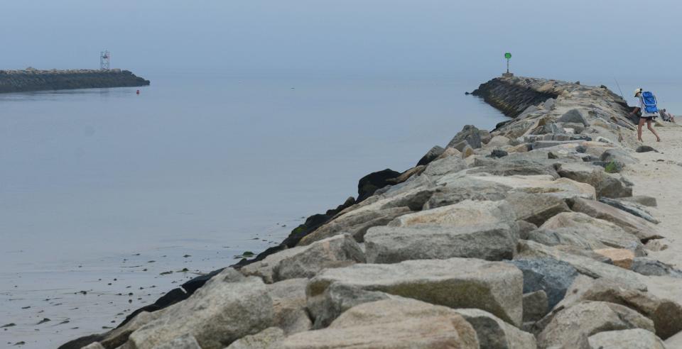 A pair of jetties mark the entrance to Sesuit Harbor in East Dennis Saturday with Cold Storage Beach at right. A boat struck the jetty Friday night killing Sadie Mauro, 17, whose body was recovered off the beach after an extensive water search.