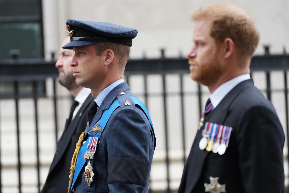 Prince William, center, and Prince Harry, right, arrive at Westminster Abbey on the day of Queen Elizabeth II funeral in central London, Monday, Sept. 19, 2022. The Queen, who died aged 96 on Sept. 8, will be buried at Windsor alongside her late husband, Prince Philip, who died last year. ( James Manning/Pool Photo via AP)