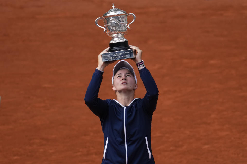 Czech Republic's Barbora Krejcikova lifts the cup after defeating Russia's Anastasia Pavlyuchenkova during their final match of the French Open tennis tournament at the Roland Garros stadium Saturday, June 12, 2021 in Paris. The unseeded Czech player defeated Anastasia Pavlyuchenkova 6-1, 2-6, 6-4 in the final. (AP Photo/Christophe Ena)