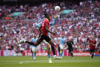 Manchester City's Jack Grealish, background, touches the ball with his hand and gives a penalty to Manchester United during the English FA Cup final soccer match between Manchester City and Manchester United at Wembley Stadium in London, Saturday, June 3, 2023. (AP Photo/Dave Thompson)