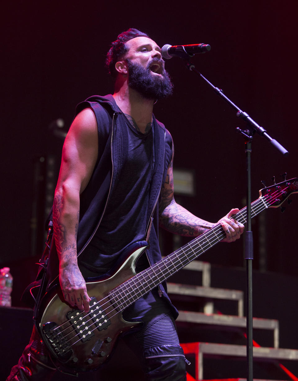 FILE - In this July 26, 2017 file photo, John Cooper of the band Skillet performs during their "The Serenity of Summer Tour" in Camden, N.J. More and more performers are changing live concerts plans because of the new coronavirus, which has forced Mariah Carey, BTS, Pearl Jam and even the Coachella festival to postpone dates. Skillet is performing the last several dates on their current tour, with shows in New York and Virginia taking place this week. Despite the spread of the virus, Cooper said he and his bandmates are still holding meet-and-greets with concertgoers. (Photo by Owen Sweeney/Invision/AP, File)