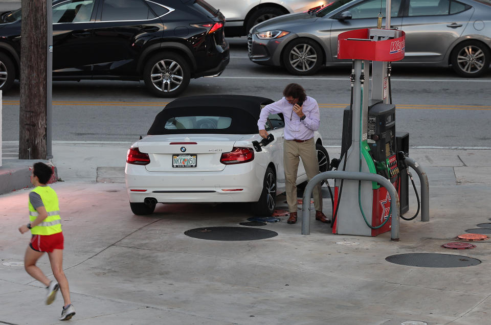 MIAMI, FLORIDA - JANUARY 23: A driver puts fuel in a vehicle at a gas station on on January 23, 2023 in Miami, Florida. Nationally, data from AAA shows that gasoline prices have risen 32.7 cents over the last month as crude oil prices have risen. (Photo by Joe Raedle/Getty Images)