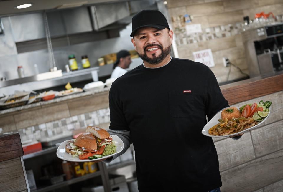 "It means 'The Windmill' in English, so keeping the (former) restaurant's namesake seemed natural," El Molino Mexican Restaurant owner Joaquin Santos says Tuesday, Nov. 28, 2023, as he holds a chicken torta plate (right) and traditional Chicken a la Creme Mexican sandwich at his new Mexican eatery inside The Windmill Travel Center & Truckstop on Lansing Road in Dimondale.