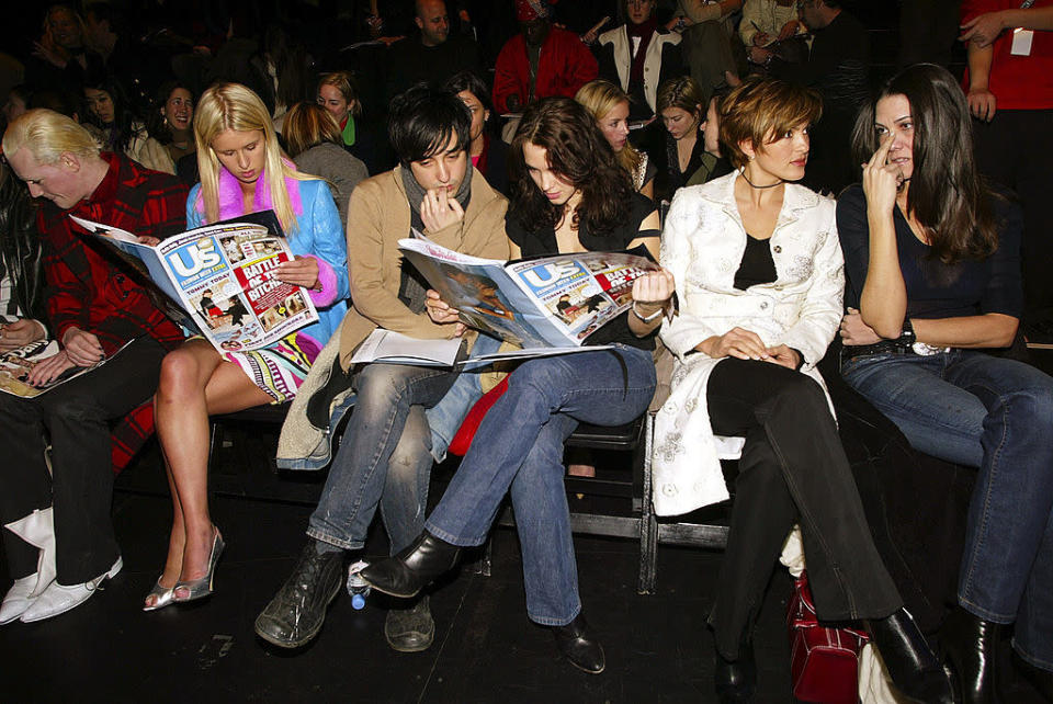 <p>Back in 2003, the front row was a little less glam than what we’re used to seeing these days. Distressed denim was the clothing of choice and issues of <i>Us Weekly</i> kept famous faces Nicky Hilton and Mariska Hargitay entertained pre-show. <i>(Scott Gries/Getty Images)</i></p>