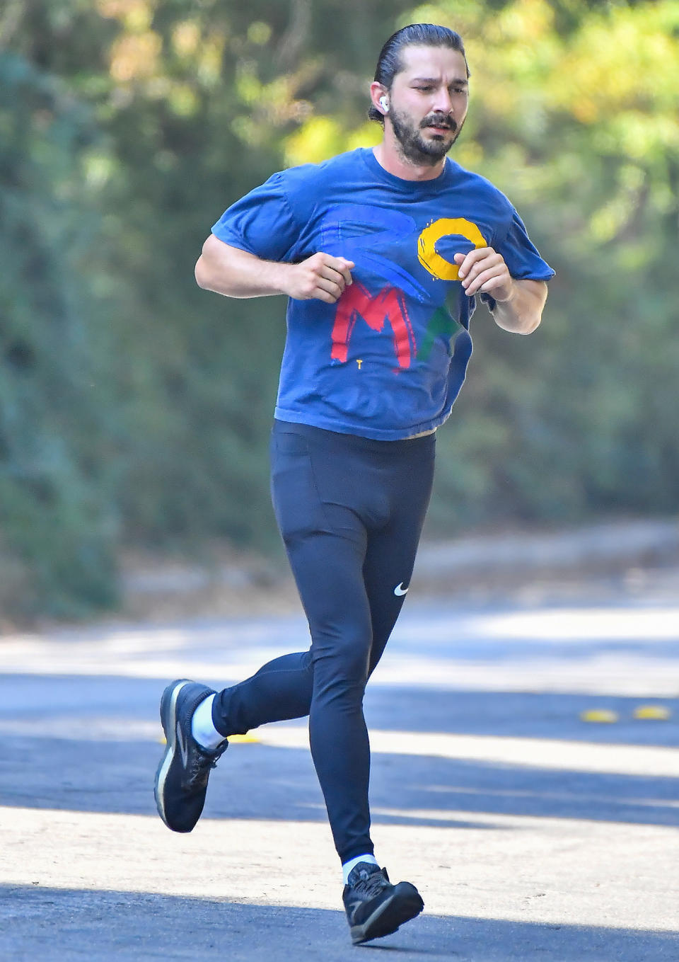 <p>Shia LaBeouf runs around his neighborhood on Wednesday wearing a t-shirt, tights and sneakers.</p>