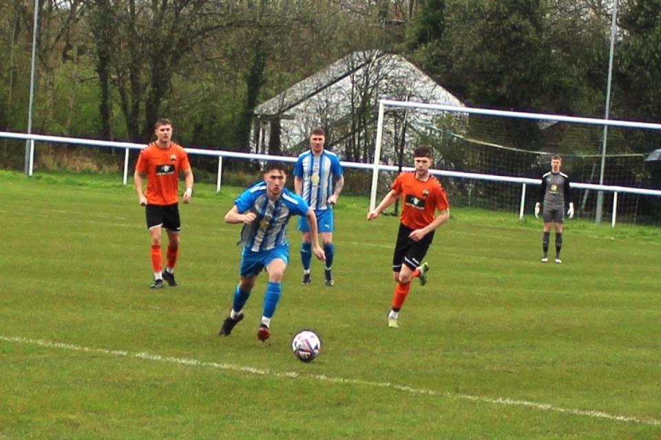 Daisy's Henry Chalkley goes on the attack against Atherton LR