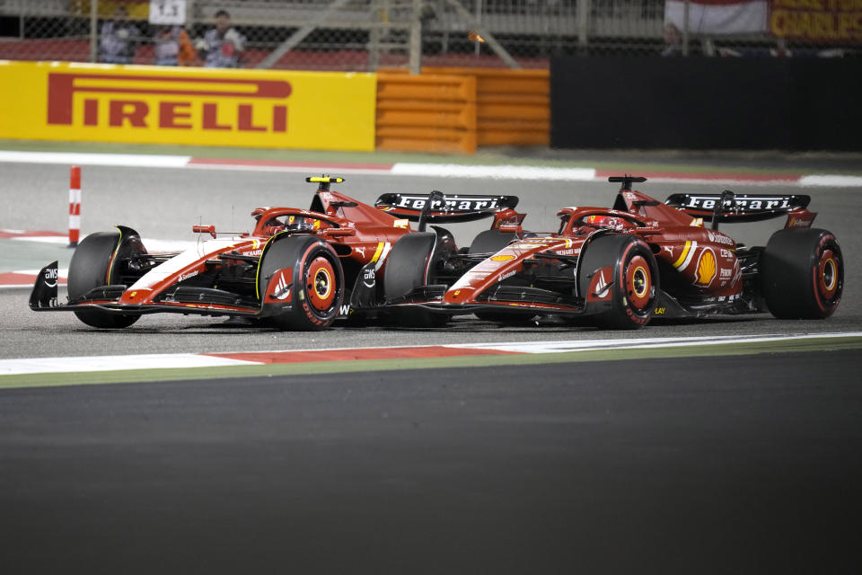 Ferrari driver Carlos Sainz of Spain and Ferrari driver Charles Leclerc of Monaco steer their cars during the Formula One Bahrain Grand Prix at the Bahrain International Circuit in Sakhir, Bahrain, Saturday, March 2, 2024. (AP Photo/Darko Bandic)