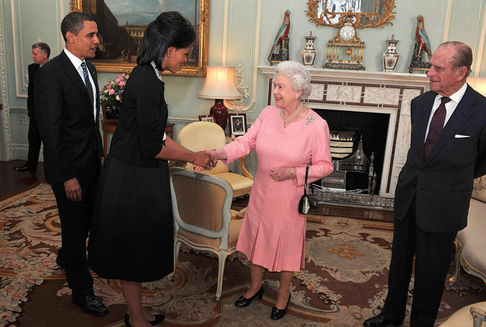 Barack Obama and Michelle Obama are greeted by the Queen and Prince Philip at Buckingham Palace in 2009