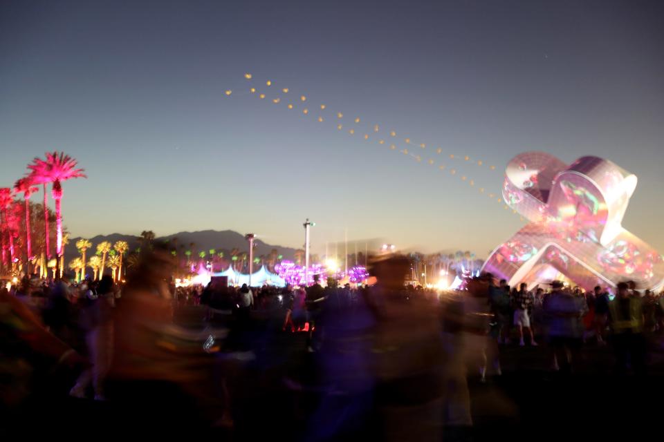 Festivalgoers roam the grounds at the Empire Polo Club during the Coachella Valley Music and Arts Festival in Indio, Calif., on Friday, April 14, 2023. 