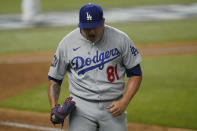 Los Angeles Dodgers pitcher Victor Gonzalez celebrates the last out against the Tampa Bay Rays during the eighth inning in Game 5 of the baseball World Series Sunday, Oct. 25, 2020, in Arlington, Texas. (AP Photo/Eric Gay)