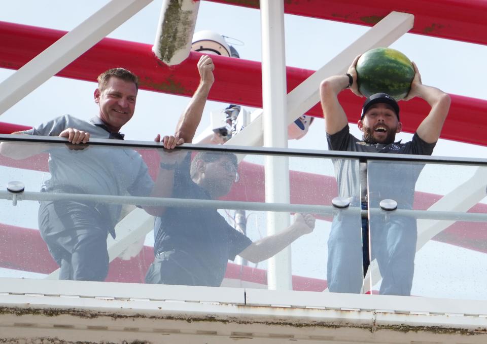 Ross Chastain, the defending NASCAR EchoPark Automotive Grand Prix race winner, throws a watermelon off the main tower at Circuit of the Americas on Friday. Chastain, who comes from a family of watermelon farmers, celebrates his wins by throwing watermelons from the top of his car.