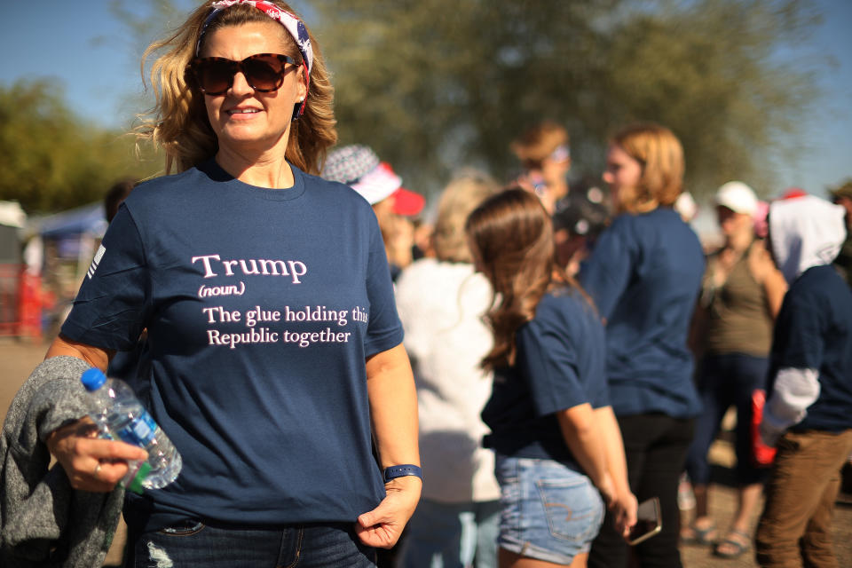 GOODYEAR, ARIZONA - OCTOBER 28: A supporter of U.S. President Donald Trump waits in line to attend a campaign rally with Tru at Phoenix Goodyear Airport October 28, 2020 in Goodyear, Arizona. With less than a week until Election Day, Trump and his opponent, Democratic presidential nominee Joe Biden, are campaigning across the country. (Photo by Chip Somodevilla/Getty Images)