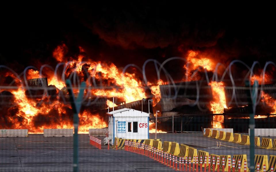 Smoke rises from burning containers at the port in the earthquake-stricken town of Iskenderun, Turkey - Reuters