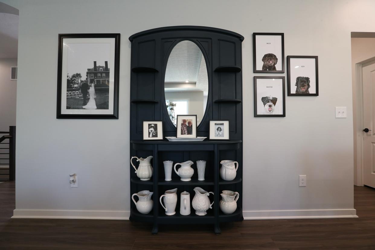 The display cabinet in the living room inside the home of Gloria and Alex Restrepo in Louisville, Ky. on Apr. 24, 2024.