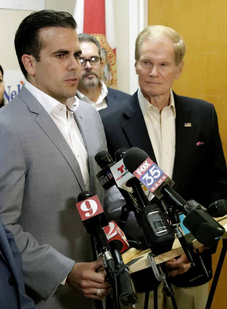 Puerto Rico Governor Ricardo Rossello, left, endorses U.S. Sen. Bill Nelson for the senate during a news conference Monday Oct. 1, 2018, in Orlando, Fla. (AP Photo/John Raoux)