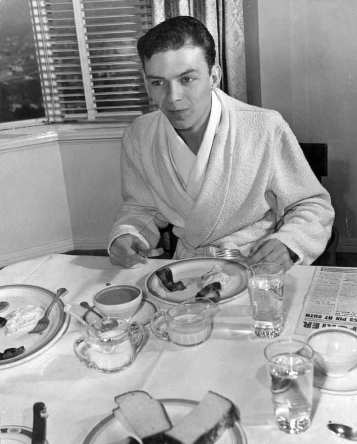 <p>Before releasing his debut solo album, <em>The Voice of Frank Sinatra</em>, in 1946, the would-be rat pack member got his start singing in clubs as a member of the Hoboken Four.</p>