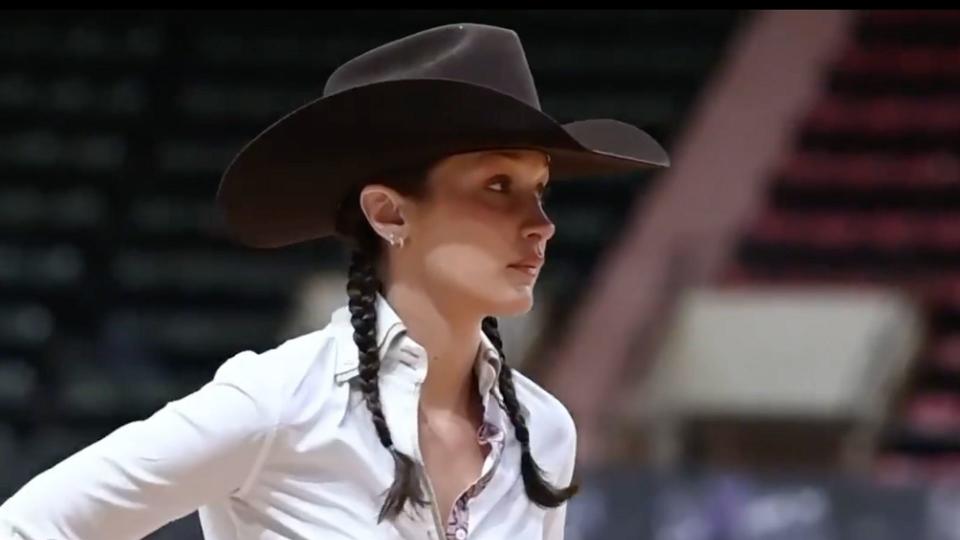 Bella Hadid wears a cowboy hat, jeans, white shirt and chaps to ride her horse