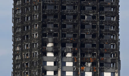 The burnt out remains of the Grenfell apartment tower is seen in North Kensington, London, Britain September 20, 2017. REUTERS/Toby Melville