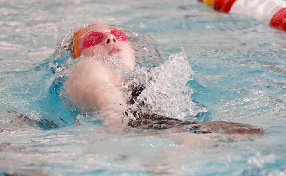 Harrison Lauren Fecher races in the 100-yard backstroke during the IHSAA girl’s swimming and diving sectionals, Saturday, Feb. 4, 2023, at the West Lafayette High School in West Lafayette, Ind. 