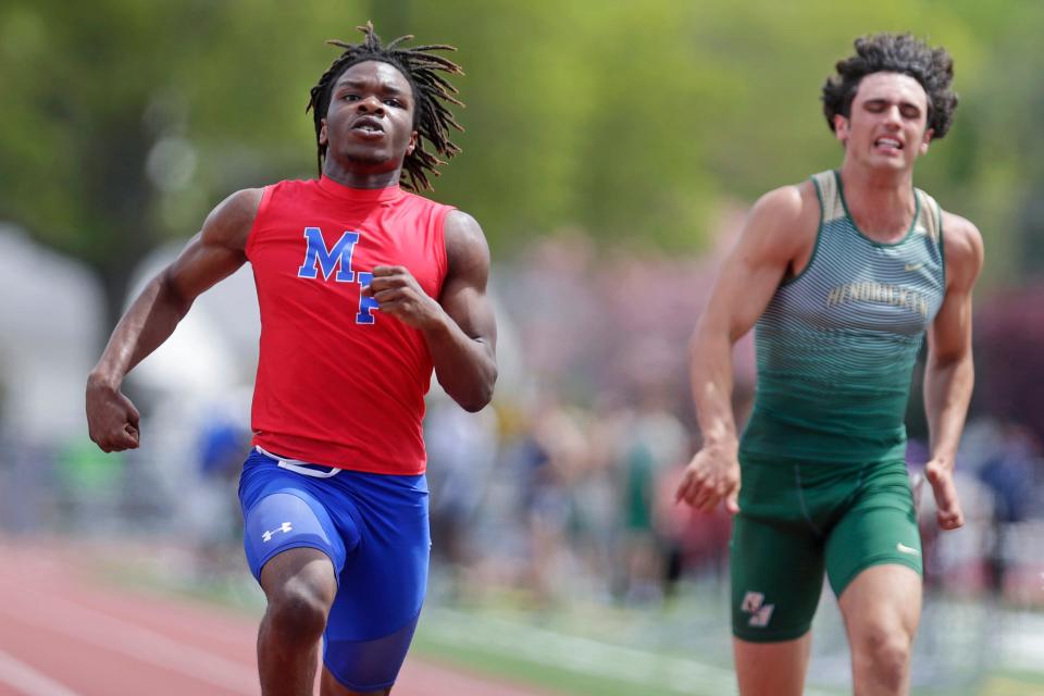 Mount Pleasant's Denzel Perry, left, is a star on the football team, but he's also one of the best sprinters in Rhode Island, which he proved at the recent Central Division Championships.