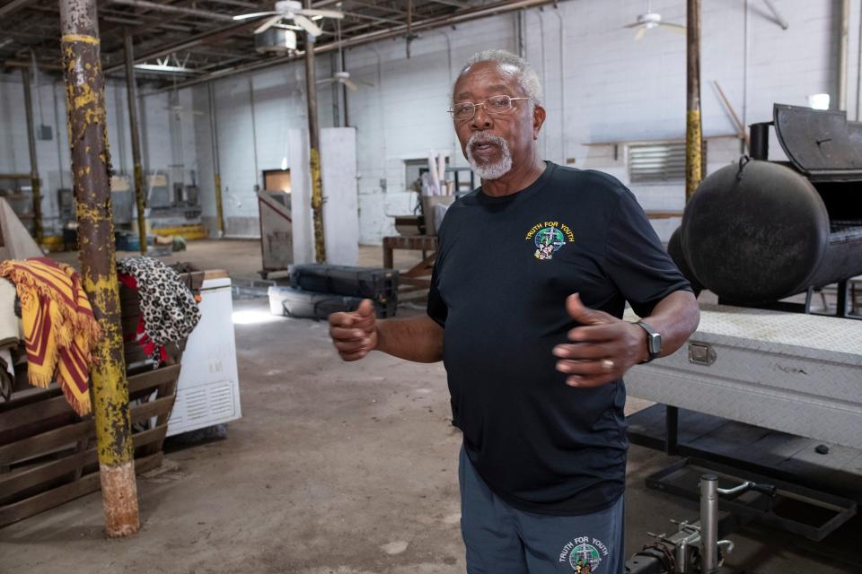 The Rev. John Powell gives a tour of the old Smith Bakery in Belmont-DeVilliers on Thursday. The Florida Trust for Historic Preservation recently named the building to Florida's 11 to Save, a list of the most threatened historic places in the state.