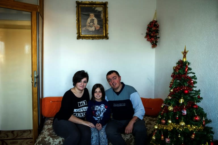 Noora Arkavazi poses with her husband Bobi Dodevski and her step-daughter at their home in Kumanovo, Macedonia