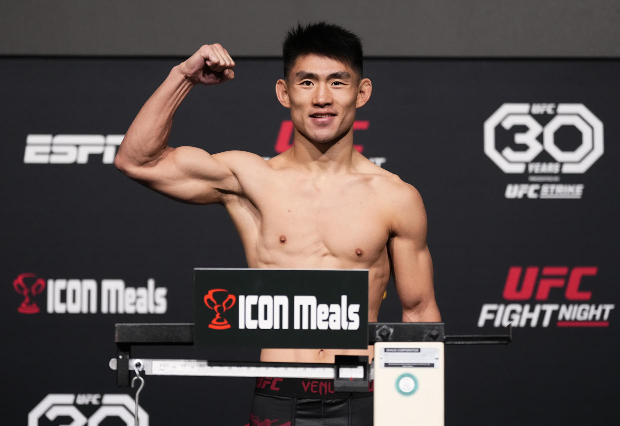 LAS VEGAS, NEVADA - APRIL 28: Song Yadong of China poses on the scale during the UFC Fight Night weigh-in at UFC APEX on April 28, 2023 in Las Vegas, Nevada. (Photo by Jeff Bottari/Zuffa LLC via Getty Images)