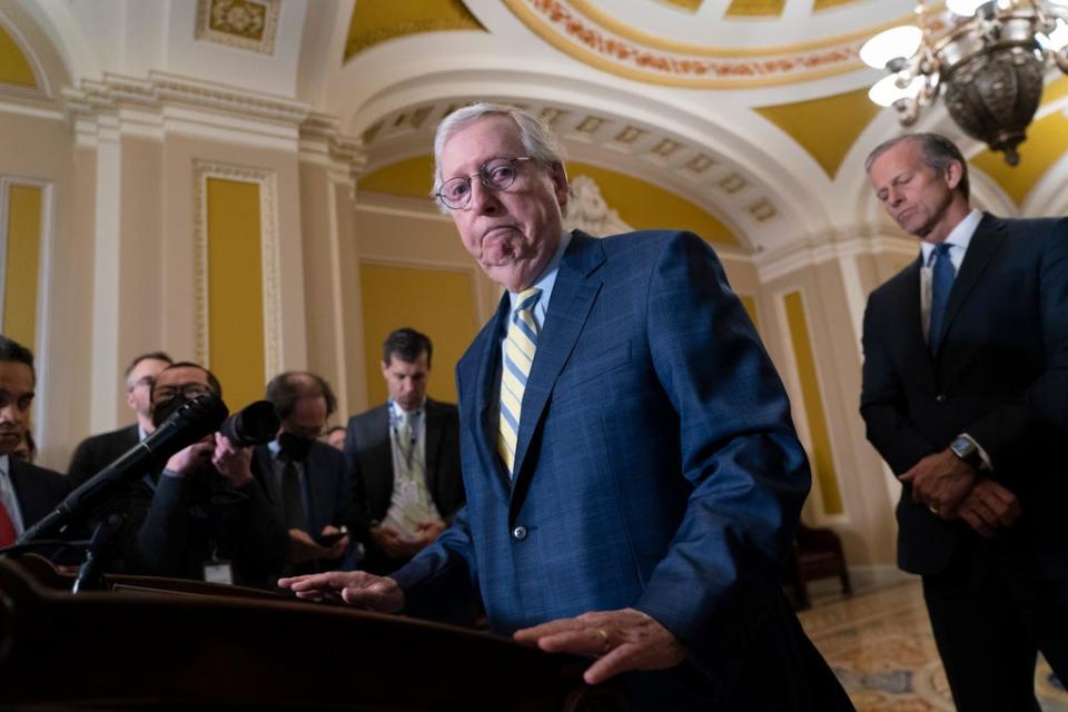 Senate Republican Leader Mitch McConnell, R-Ky., joined at right by Senate Republican Whip John Thune, R-S.D., finishes remarks to reporters following a closed-door policy meeting, at the Capitol in Washington, Tuesday, Dec. 13, 2022.