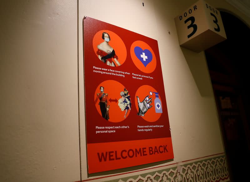 A welcome back sign requesting that people maintain precautions, is seen at the Royal Albert Hall in London