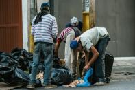 An economic crisis marked by severe shortages has left some Venezuelans scavenging for food, as seen here in Caracas on February 22, 2017