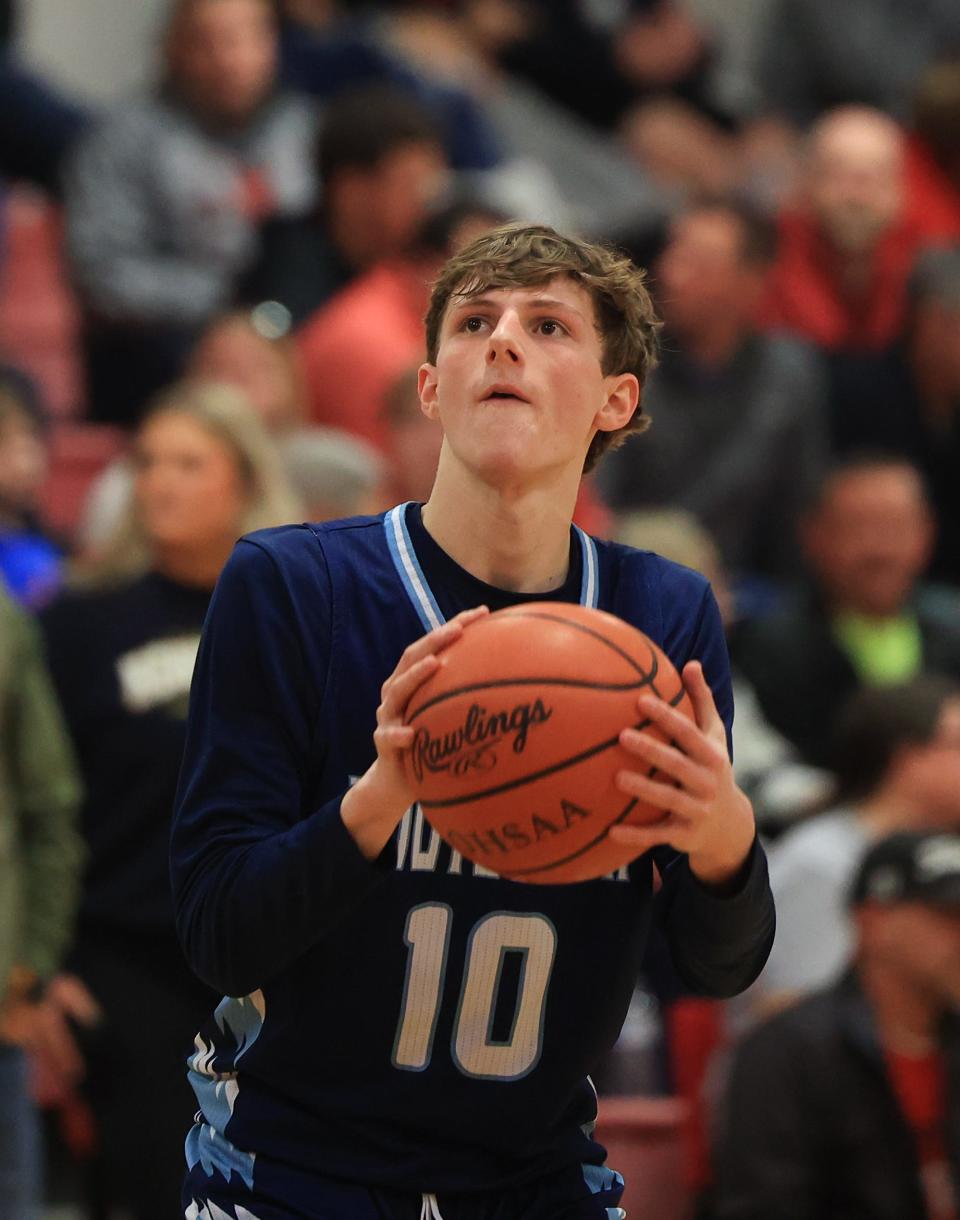 Rootstown senior Nick Wancik eyes the basket for a 3-point shot during Tuesday night’s game against the Falcons at Field High School. Field defeated Rootstown 61-50.