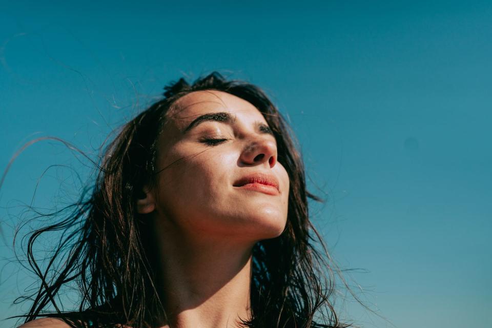 self portrait photo of a young woman at the beach