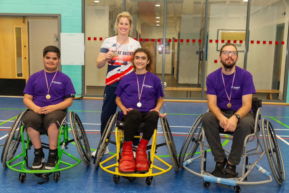 Robyn Love alongside aspiring Paralympic wheelchair basketball players