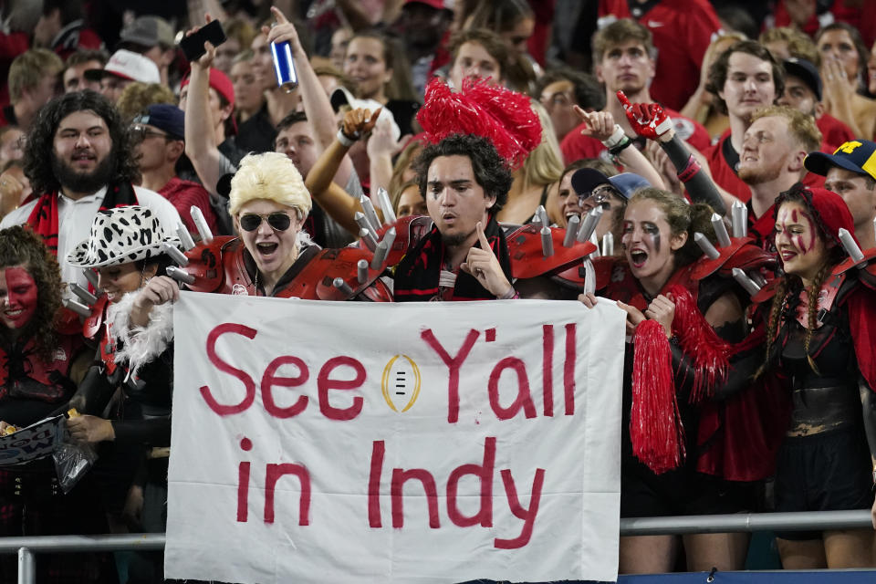 Georgia fans celebrate during the second half of the Orange Bowl NCAA College Football Playoff semifinal game against Michigan, Friday, Dec. 31, 2021, in Miami Gardens, Fla. (AP Photo/Lynne Sladky)