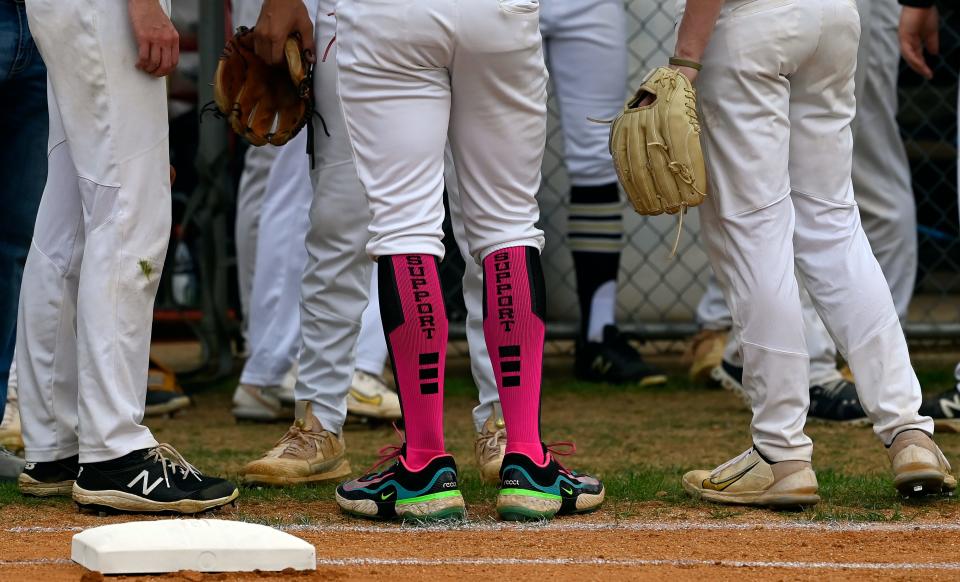 Stewart County high school pitcher Connor Lehman wears pink socks before a game against Montgomery Central in memory of his mother, Amelia Lehman, who passed away six years ago, April 29, 2024, in Dover, Tenn. Lehman has committed to the University of Alabama.