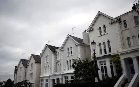 Picture shows a row of residential houses; the PRA lending squeeze is the latest in a string of hammer blows for buy-to-let investors - Credit: Simon Dawson/Bloomberg Finance LP