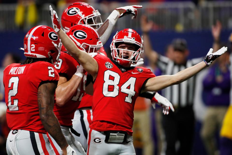 Georgia wide receiver <a class="link " href="https://sports.yahoo.com/ncaaf/players/313684" data-i13n="sec:content-canvas;subsec:anchor_text;elm:context_link" data-ylk="slk:Ladd McConkey;sec:content-canvas;subsec:anchor_text;elm:context_link;itc:0">Ladd McConkey</a> (84) celebrates after scoring a touchdown during the first half of the SEC Championship NCAA college football game between LSU and Georgia in Atlanta, on Saturday, Dec. 3, 2022.