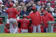 Los Angeles Angels' Taylor Ward (3) celebrates after his two-run home run that also drove in Anthony Rendon (6) during the third inning of a baseball game against the Boston Red Sox, Saturday, April 13, 2024, in Boston. (AP Photo/Michael Dwyer)