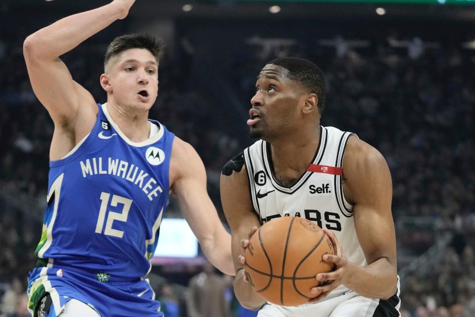 San Antonio Spurs guard Malaki Branham looks to shoot in front of Bucks guard Grayson Allen during the first half, Wednesday, March 22, 2023, in Milwaukee.