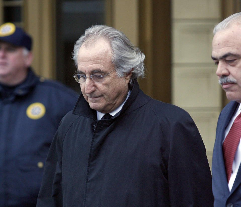 FILE - In this Jan. 14, 2009 file photo, Bernie Madoff leaves Federal Court in New York. Madoff, the financier who pleaded guilty to orchestrating the largest Ponzi scheme in history, died early Wednesday, April 14, 2021, in a federal prison, a person familiar with the matter told The Associated Press. ( AP Photo/Stuart Ramson, File