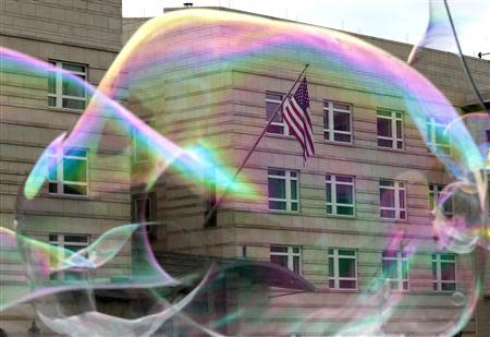 Soap bubbles from a street artist float in front the U.S. embassy in Berlin October 25, 2013. REUTERS/Tobias Schwarz