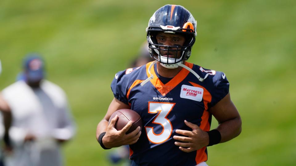 Denver Broncos quarterback Russell Wilson takes part in drills at the NFL football team's headquarters Monday, June 6, 2022, in Centennial, Colo.