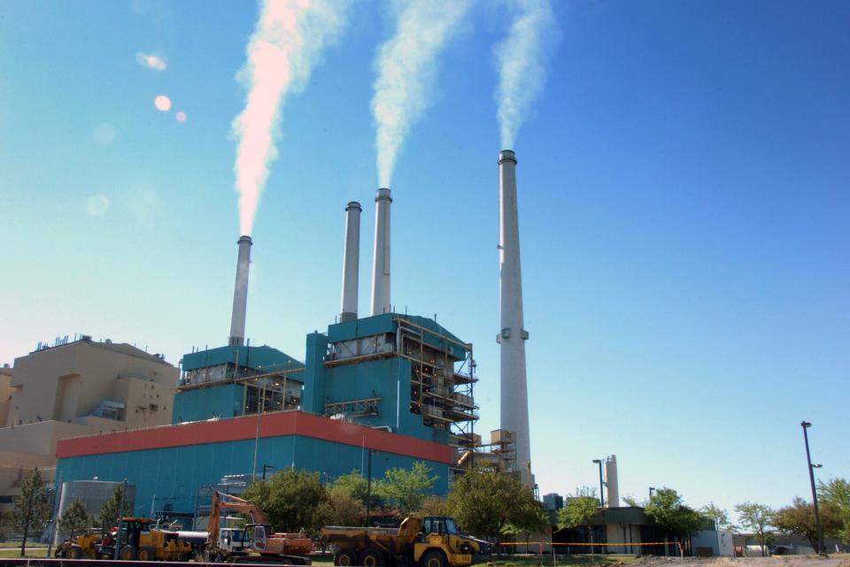 Amoke rises from the Colstrip Steam Electric Station, a coal burning power plant in Colstrip, Mont., in 2013.