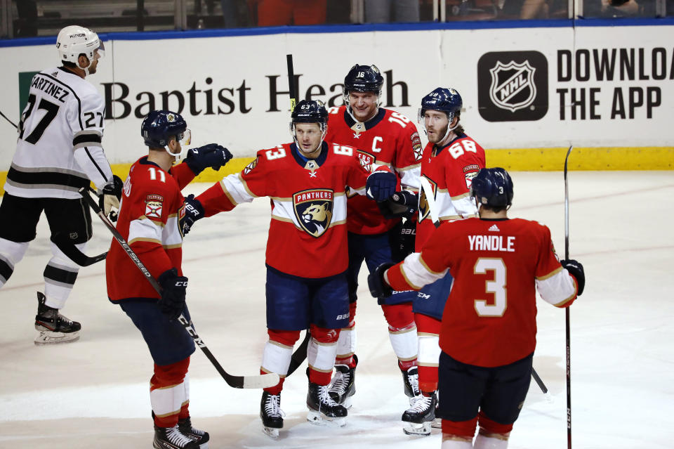 Florida Panthers right wing Evgenii Dadonov (63) celebrates with teammates after scoring during the first period of an NHL hockey game against the Los Angeles Kings, Thursday, Jan. 16, 2020, in Sunrise, Fla. (AP Photo/Brynn Anderson)