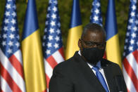 U.S. Defense Secretary Lloyd Austin stands during a joint press conference with Romanian Defense Minister Nicolae Ciuca during a welcoming ceremony in Bucharest, Romania, Wednesday, Oct. 20, 2021. Austin is visiting Romania before attending the NATO Defense Ministerial in Brussels. (AP Photo/Andreea Alexandru)