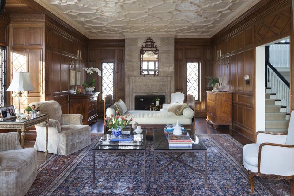 A statement ceiling commands attention in a paneled room