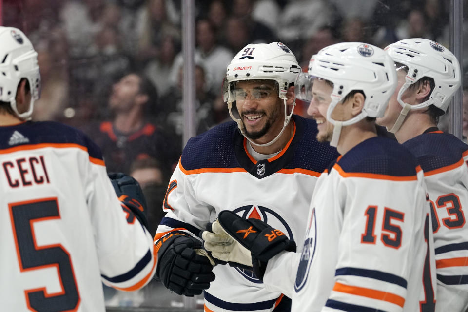 Edmonton Oilers left wing Evander Kane, second from left, celebrates his goal with defenseman Cody Ceci, left, right wing Josh Archibald, second from right, and center Ryan Nugent-Hopkins during the third period in Game 3 of an NHL hockey Stanley Cup first-round playoff series against the Los Angeles Kings Friday, May 6, 2022, in Los Angeles. (AP Photo/Mark J. Terrill)